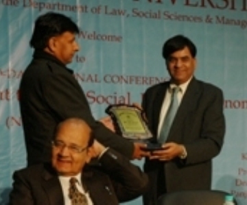 Manav Bharti-chairman presenting momento