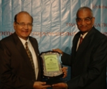 Manav Bharti-chancellor presenting momento