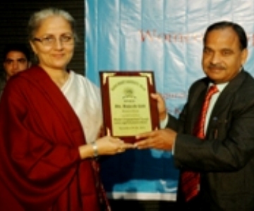 Manav Bharti-vice chancellor giving momento