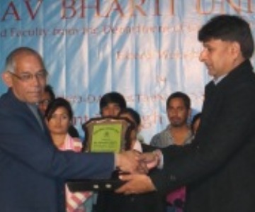 Manav Bharti-MBU presenting momento